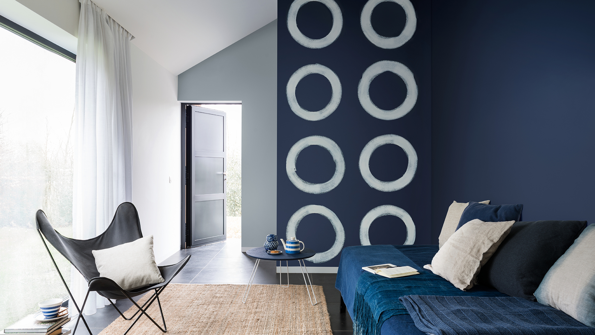 Blue circle motif The liberating use of freehand painted shapes can give a dynamic creativity to your home.